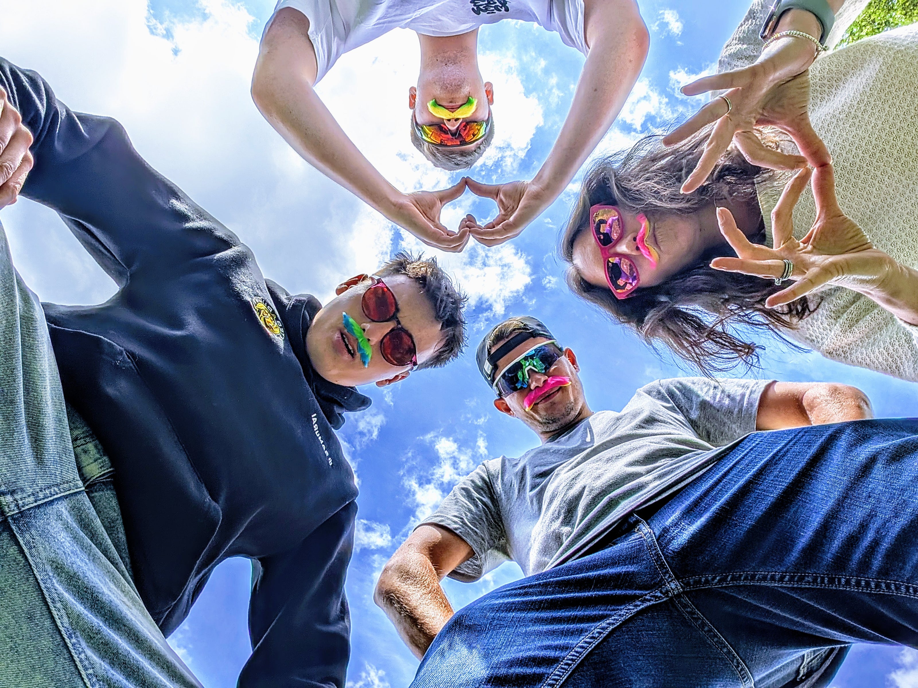 Lobster eyewear team looking down at a camera wearing sunglasses 